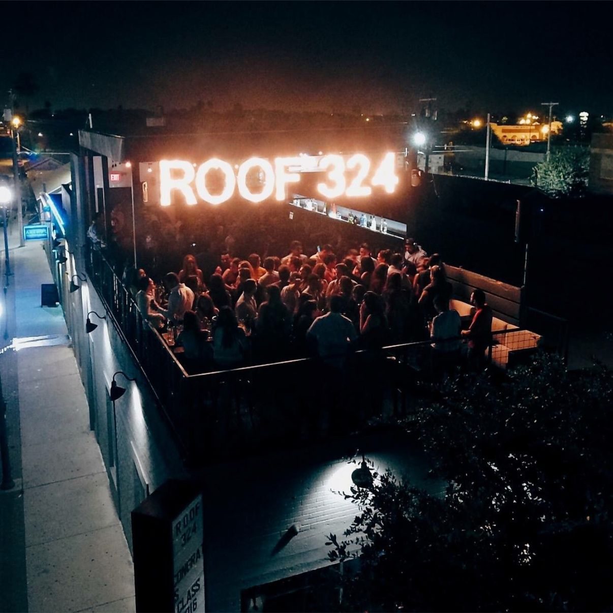 Roof 324 — rooftop crowd beneath the marquee